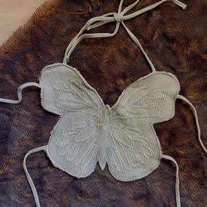 Vintage light denim butterfly tied top.